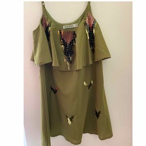Flirty olive dress with tiered layers.